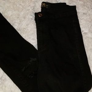 Black high waisted ripped knee skinny jeans